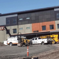 Construction vehicles work on Marshfield Jr High